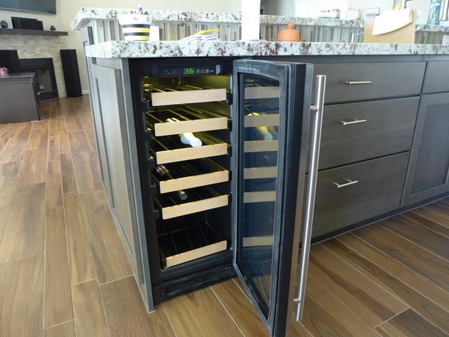 Wine cooler fits in nicely right at the end of the island sink.