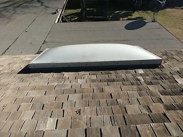 This is the old wood shake roof before we replaced it.