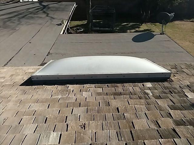 This is the old wood shake roof before we replaced it.