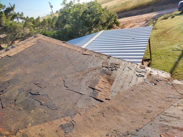 During the tear-off of the old roof.