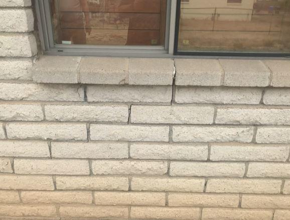 Exterior Stairstep Cracks Near a Window