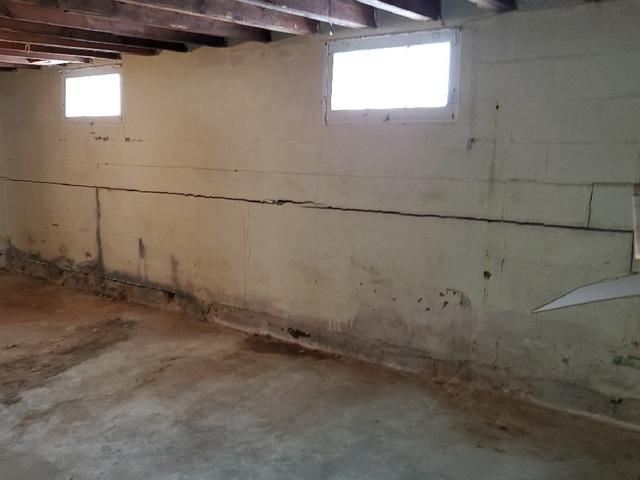 Free Estimate to Investigate Deep Wall Crack Leaking Water Onto Basement Floor