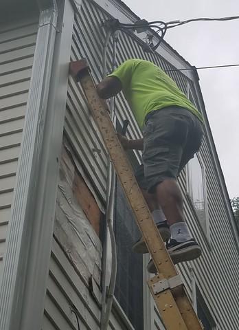 A team member is providing carpentry repair work.