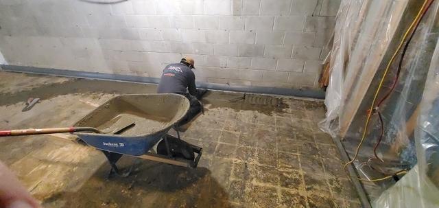 Applying Our Finish To Our Concrete Against The Right Hand Wall