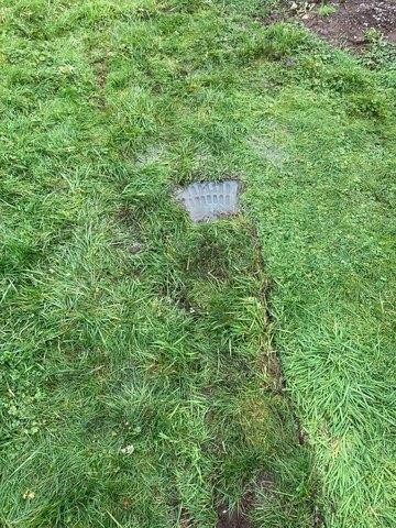 The final destination for water is this LawnScape Outlet at the end of a buried exterior discharge line to get rid of water away from the home.