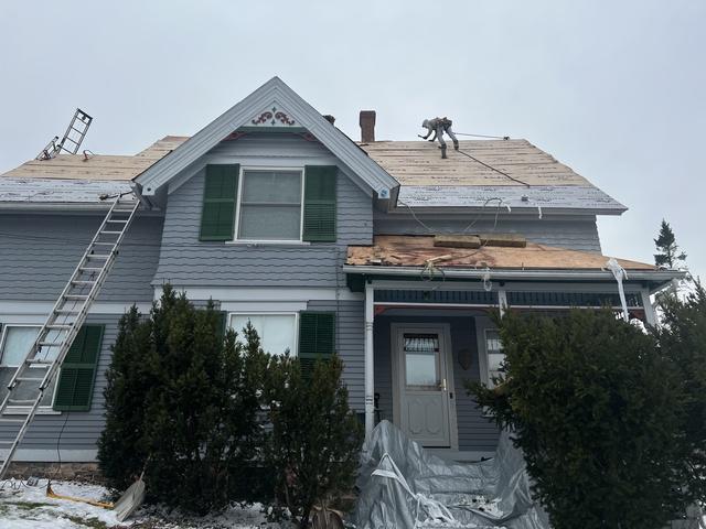 Side shot of crew working on Victorian Home