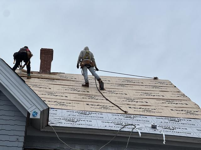 Crew using harness for safety