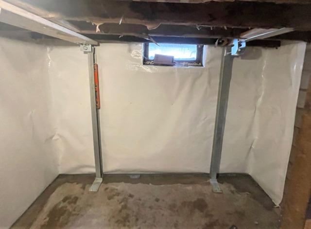 Cracked and Sheering Basement Wall Stabilized with  PowerBrace™ Support Beams in Duluth, MN Basement