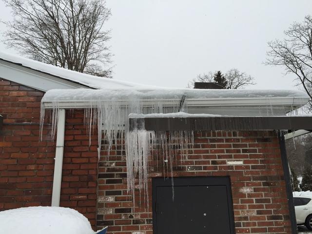 <p>Do you have icicles hanging from your gutters? When the upper area of the roof warms up and melts the snow, the cold eaves freeze the water runoff, forming icicles like the ones seen here.</p>