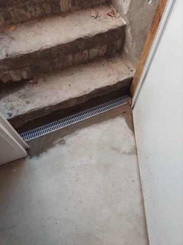 The Trench Drain is installed by the entryway to prevent flooding from outside.