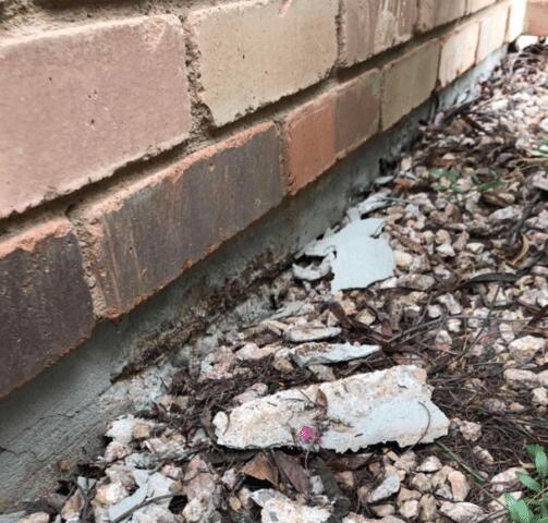 Concrete Repair Stem Wall Process: Removing Damaged Paint