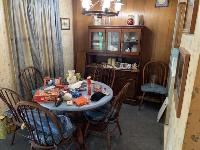 A dining room set, china cabinet, dishes, and other household items.