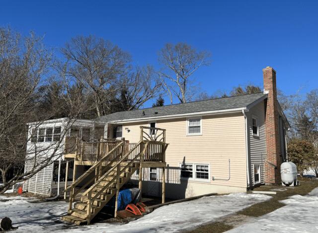 Back Side Of Raised Ranch Style Home