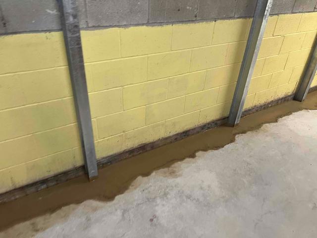 WaterGuard floor drainage system installed to collect the water that had been passing through the basement walls