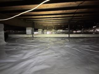 A 20-mil CleanSpace vapor barrier was installed over the dirt flooring of the crawl space. This heavy-duty liner will help protect the crawl space from the moisture rising from the earth. It also comes with an antimicrobial, called UltraFresh, built into the material, which will help to prevent mold growth on the vapor barrier, itself.