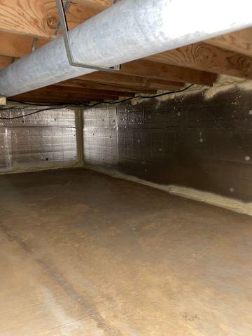 SilverGlo paneling and spray foam were used to seal up this crawl space.