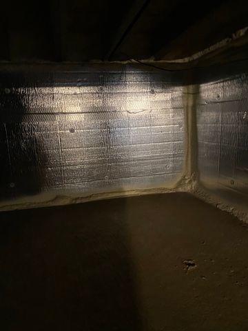 SilverGlo paneling and spray foam were used to seal up this crawl space.