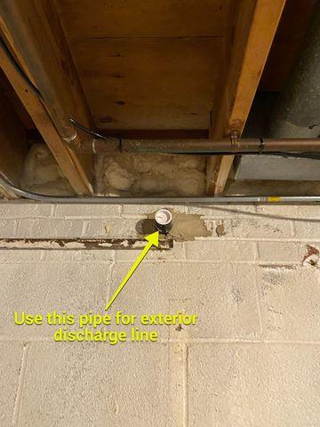 This home came equipped with an unused pipe for discharging water from the basement, to outside.