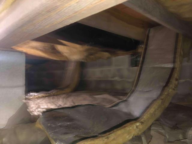 Fiberglass insulation absorbs the excess moisture like a sponge. Often when you see batts fallen from the floor joists like this, it's a result of their absorbing the excess moisture in the space and becoming too heavy to stay between the floor joists, leaving you with no insulation in your floors.