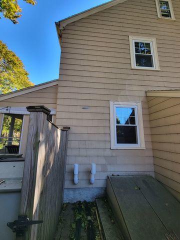 Between those two white PVC pipes is where the radon mitigation system will be installed.