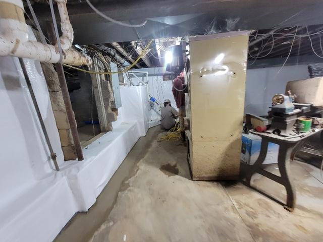 Basement Waterproofing Crew Working