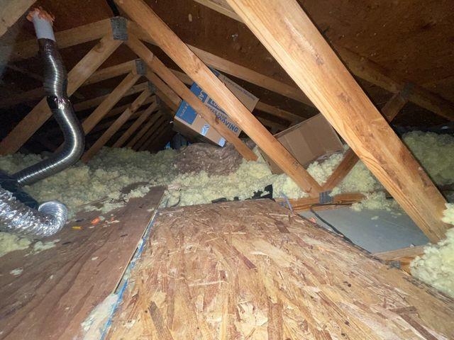 Old Attic Insulation Gets Removed