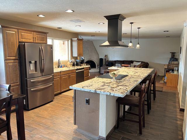 This once dated and closed-off kitchen now flows perfectly from the dining space into the living space.