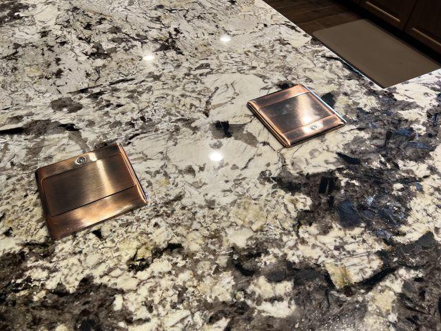 A closer look at the Winter Thaw Granit and the pop-up bronze finish outlets.