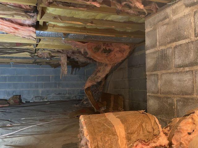 You can clearly see how moisture is making its way through the cinder block walls of the crawl space.  This can cause musty nasty air inside.  Eventually, this air works its way into the home above.