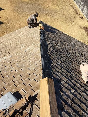 A Fortenberry Roofing team member began to lay down the cedar shakes needed for the ridge replacement.