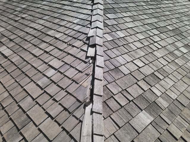 One of the areas on this roof that needed repair. The owner decided to get the whole ridge of the house replaced.