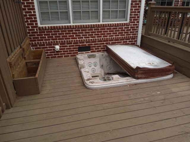 Our customer bought a home that had this hot tub already installed in their deck. They finally decided to get around to having the hot tub removed.