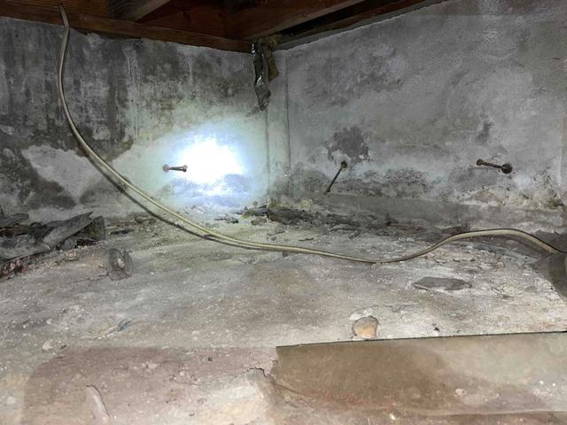 There are many exposed areas of the crawl space where the earth's moisture can rise into the area and raise the relative humidity. This can lead to cold floors in the winter, high energy bills, and mold or mildew growth. The floors were also littered with debris and old material, making it difficult for service persons to maneuver around the crawl space.