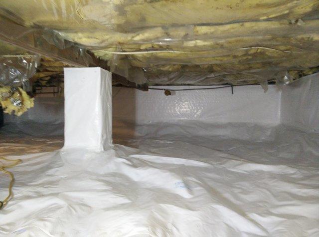 This dirty crawlspace has been transformed into a clean, dry place that can be used as storage. 