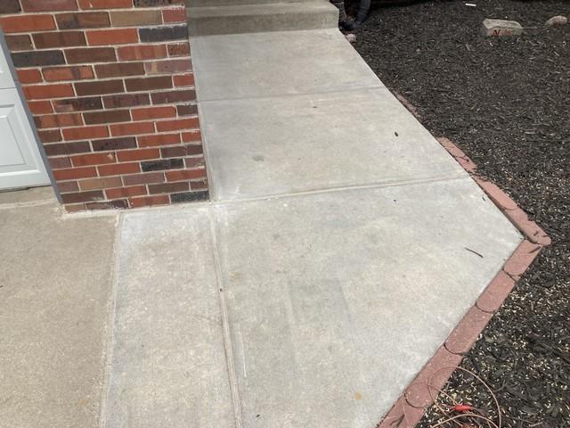 This homeowner replaces their front walkway and step but it still settled. We came in and leveled the new concrete back up to be even with the driveway. Check out the Job story to see how far the new concrete dropped.