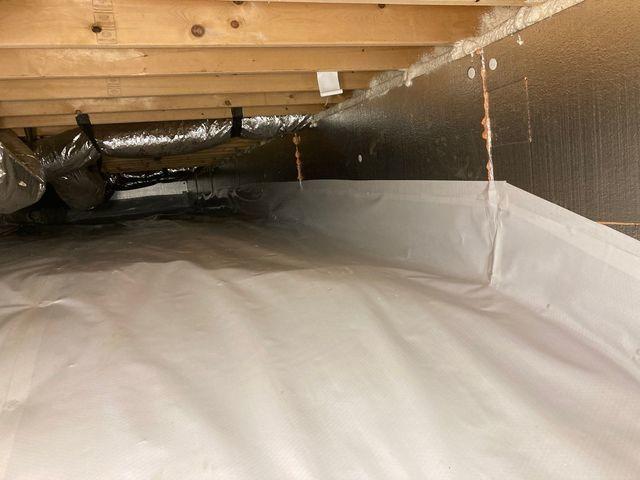 Rim joist sealed with spray foam, SilverGlo panels insulating the walls, and CleanSpace covering the ground.