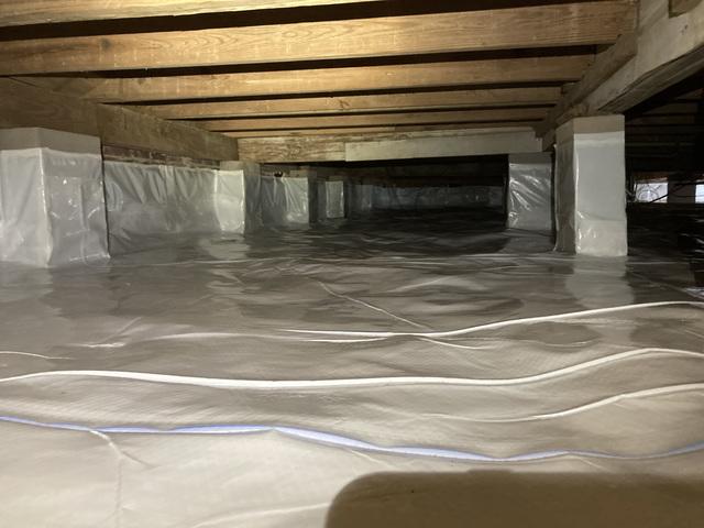 We cleaned out all the lingering debris and encapsulated the crawlspace. Not only will this help control the moisture and humidity, but it makes for an easier crawl when work has to be done or inspected under the home.