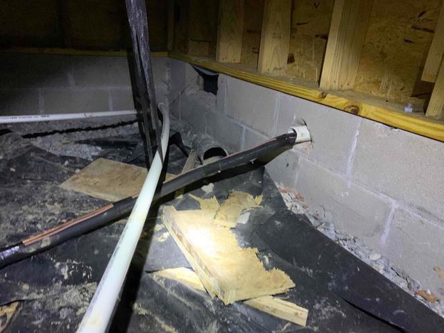 The walls of this crawl space were made with porous cinderblocks, which means that moisture is able to seep through them and raise the relative humidity. The open vents lining these walls are also allowing the outside air and moisture to freely enter and further disrupt the environment of the crawl space.