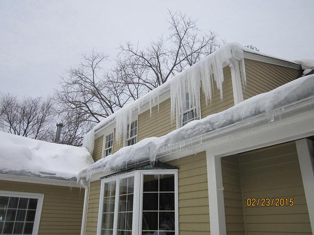 The second story roof has ice damming problems, too.  The water and ice dripping down onto the lower roof compounds the damage.