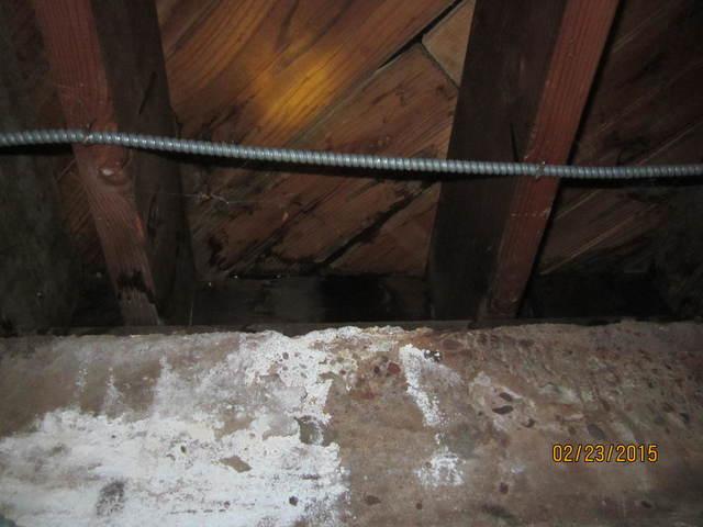 Here again you can see the efflorescence on the basement wall. The floor joists above are also wet. Water in this basement can lead to all types of damage including mold and wood rot.</p>