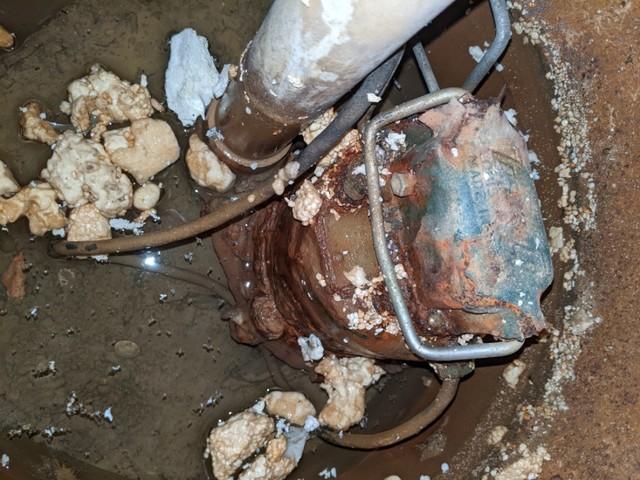 A sad, dirty neglected sump pump