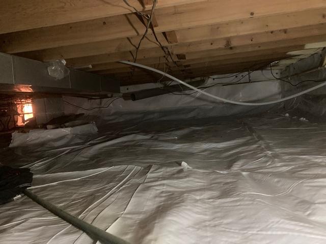 This home was experiencing an odder and cold floors from the crawlspace. By encapsulating the crawlspace, it prevented moister from entering and controlled the temperature of the area and the home.