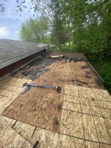 Replacing the rotted OSB boards. You can see the difference between the old to the new