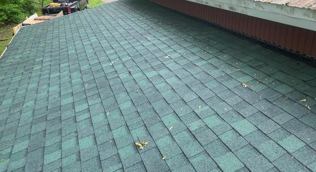 The roof is complete. New OSB boards, ice and water shield, and new asphalt hunter green GAF shingles.