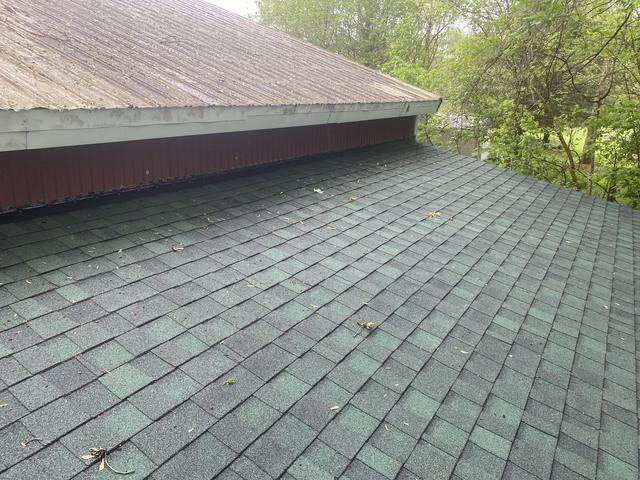 The roof is complete. New OSB boards, ice and water shield, and new asphalt hunter green GAF shingles.