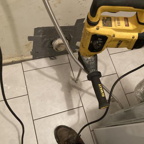 First, we drilled into the flooring in the laundry room, by the front stoop, and around the entire exterior of the home.