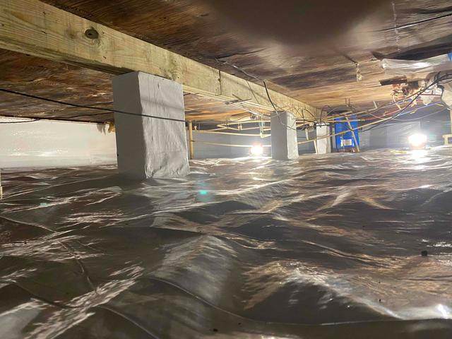 CleanSpace vapor barrier installed to isolate the crawl space ground from the home to prevent moisture from passing through