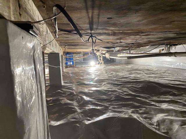 CleanSpace vapor barrier installed to prevent moisture from passing through the crawl space ground