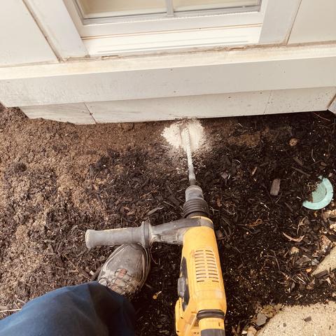 Next, for an effective treatment, we drilled into the flooring in the bathroom, the concrete slab, and around the exterior of the home...