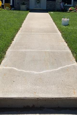 The Step and Sidewalk leading to the front porch of this home were lifted back to their original level using PolyLevel Concrete Leveling. After that, the cracks and joints were sealed with NexusPro Cracked Concrete Repair.